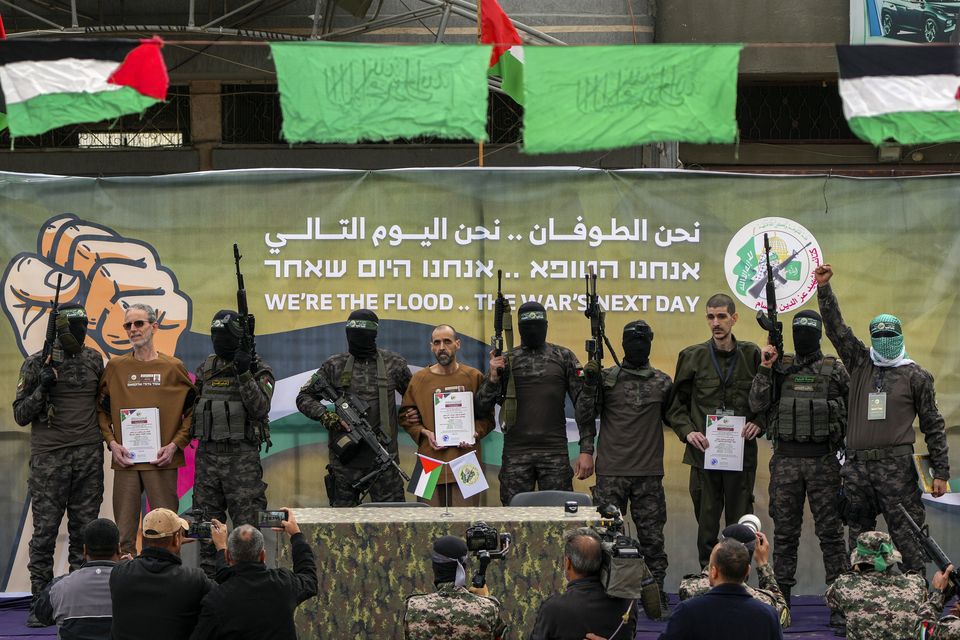 Israeli captives Ohad Ben Ami, Eli Sharabi and Or Levy were handed over to the Red Cross (Abdel Kareem Hana/AP)