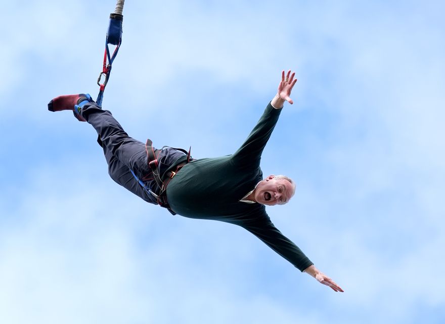 Liberal Democrat leader Sir Ed Davey taking part in a bungee jump during a visit to Eastbourne Borough Football Club (Gareth Fuller/PA)