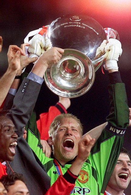 Peter Schmeichel lifts the Champions League in 1999 (Phil Noble/PA)