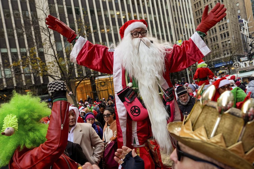 SantaCon events were taking place around the world (Julia Demaree Nikhinson/AP)