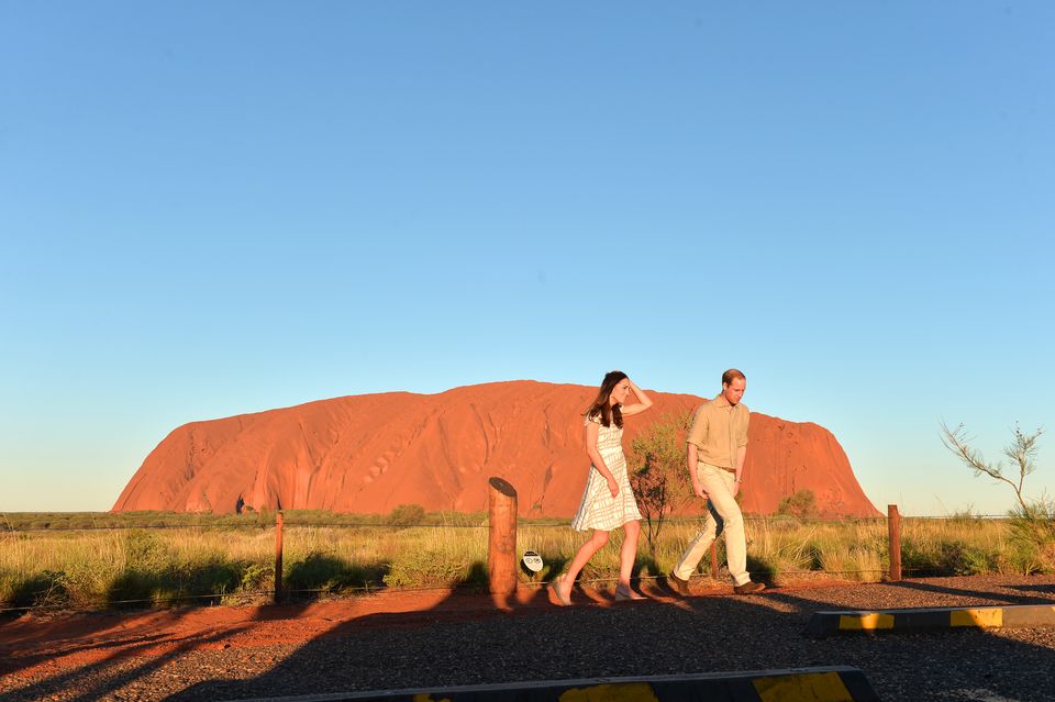 The Duke and Duchess of Cambridge pose for media with Uluru in the background during the 16th day of their official tour to New Zealand and Australia in 2014 (Anthony Devlin/PA)