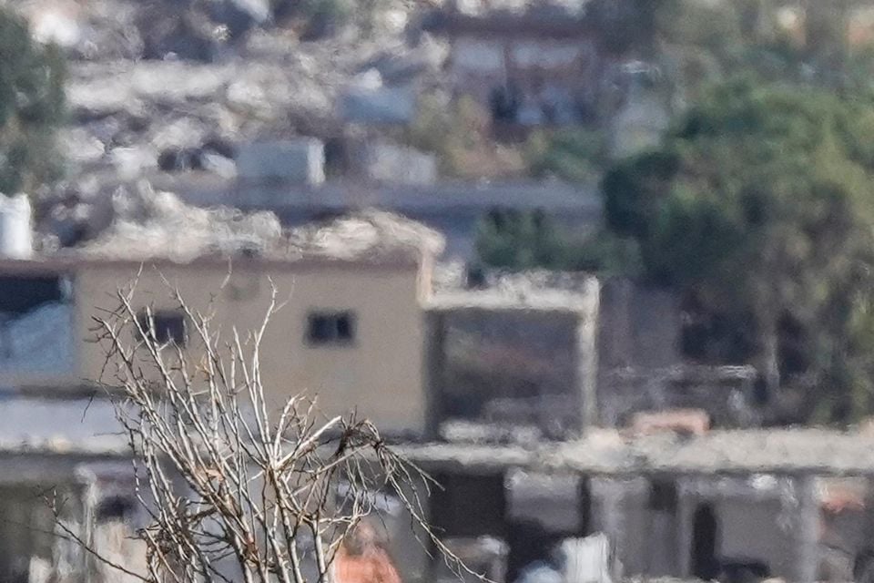 Israeli soldiers take a position to block a road in the southern Lebanese village of Aitaroun (Bilal Hussein/AP)