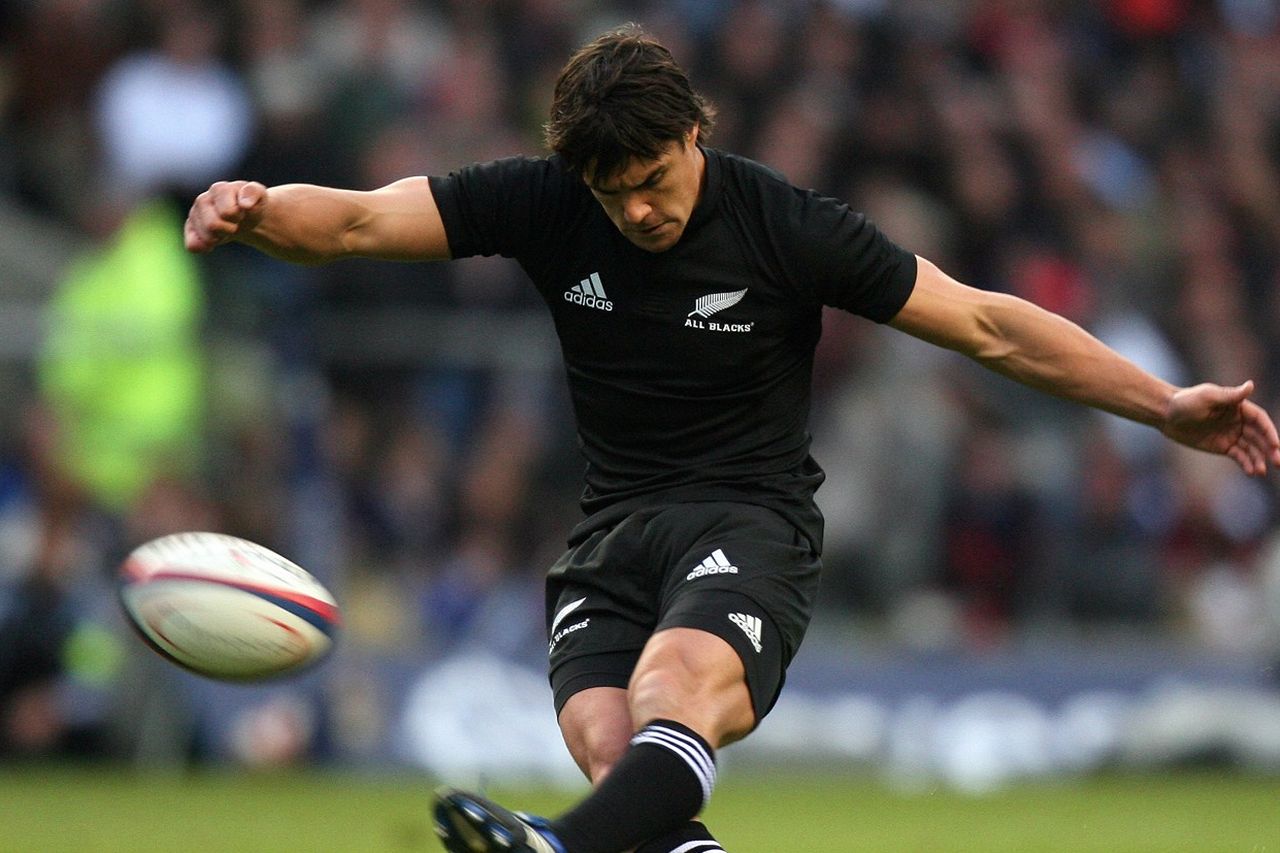 Dan Carter kicking ball in super 14 rugby union game at the