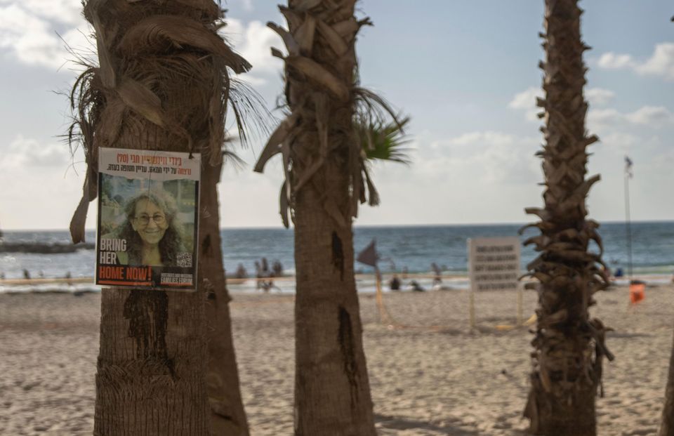 Signs calling for the release of hostages are plastered on trees in Tel Aviv’s beach in Israel (AP Photo/Ohad Zwigenberg)