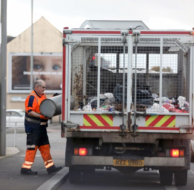 Former cop William McGonigle emptying bins in Lurgan