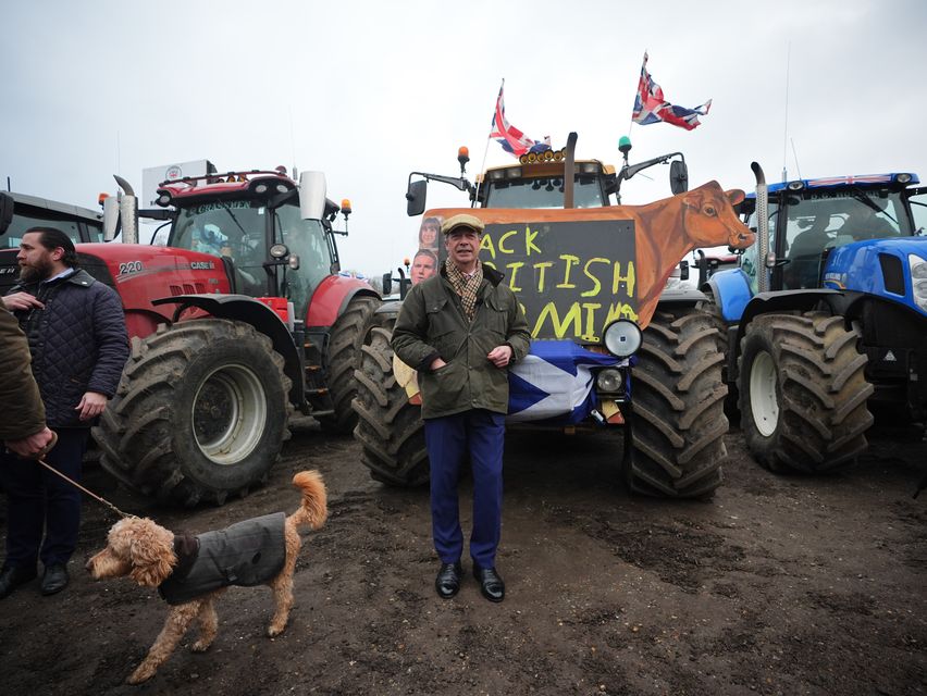 Mr Farage joined farmers and their tractors at Belmont Farm in north London on Monday morning (James Manning/PA)