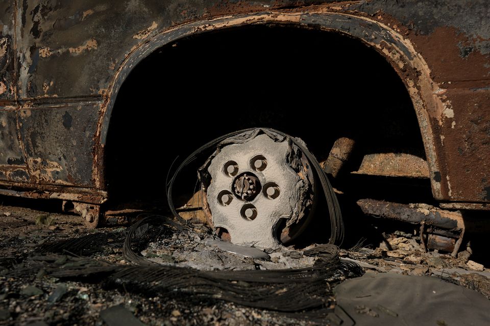 The remains of a vehicle destroyed in the Eaton Fire on Monday (Carolyn Kaster/AP)