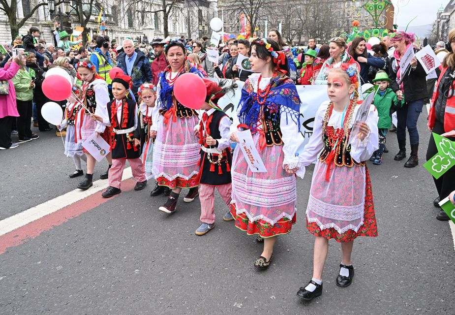 A group in traditional Eastern European dress take part in the St Patrick's Day parade in Belfast (Presseye.)