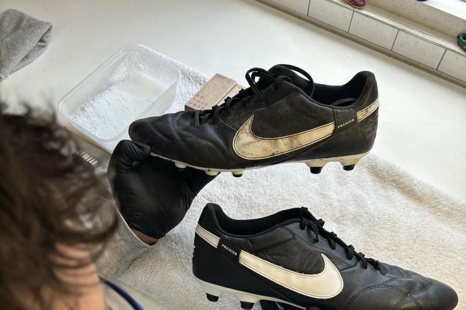 Daniel restoring a pair of football boots