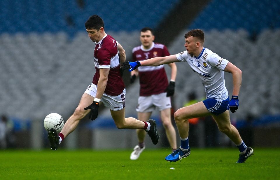 Conor Loftus gets away from Ballinderry's Charlie Crozier