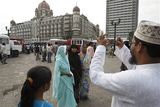 thumbnail: A family takes photo as they visit the Taj Mahal hotel where Indian commandos had a severe operation against terrorists, in Mumbai, India, Saturday, Nov. 29, 2008. Indian commandos killed the last remaining gunmen holed up at a luxury Mumbai hotel Saturday, ending a 60-hour rampage through India's financial capital by suspected Islamic militants that killed people and rocked the nation. (AP Photo/Saurabh Das)