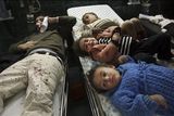 thumbnail: Palestinian children and a man wounded in Israeli missile strikes are seen in the emergency area at Shifa hospital in Gaza City, Saturday, Dec. 27, 2008. Israeli warplanes demolished dozens of Hamas security compounds across Gaza on Saturday in unprecedented waves of simultaneous air strikes. Gaza medics said at least 145 people were killed and more than 310 wounded in the single deadliest day in Gaza fighting in recent memory. (AP Photo/Khalil Hamra)