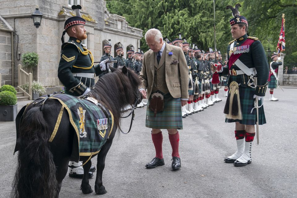 The King performing a traditional inspection of the troops outside Balmoral in August (Jane Barlow/PA)