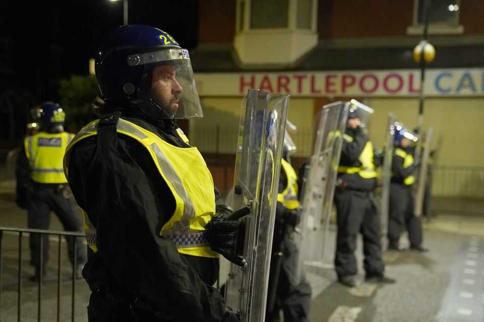 Riot police dispersed protesters in Hartlepool during a night of violent outbreaks (Owen Humphreys/PA)