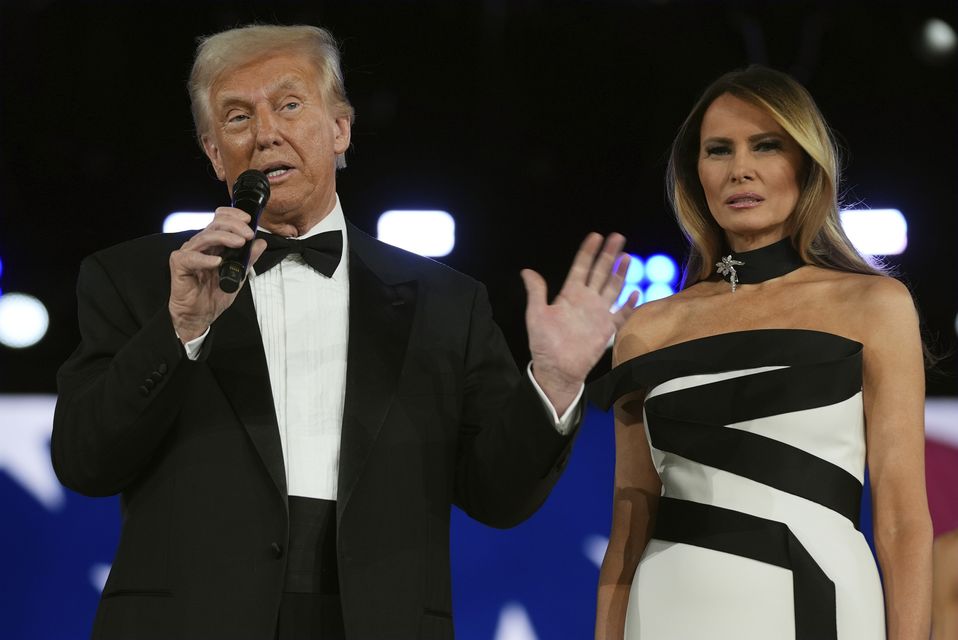 President Donald Trump speaks as first lady Melania Trump listens at the Liberty Ball, part of the 60th Presidential Inauguration (AP/Evan Vucci)