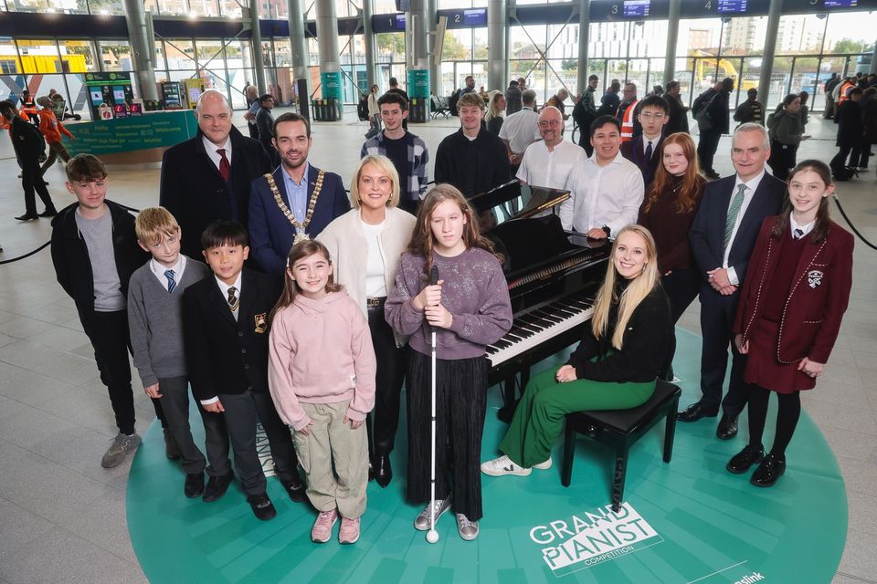 The pianists entertained passengers at the transport hub (Translink/PA)