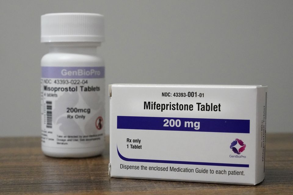 Containers of the medication used to end an early pregnancy sit on a table inside a Planned Parenthood clinic (Jeff Roberson/AP)