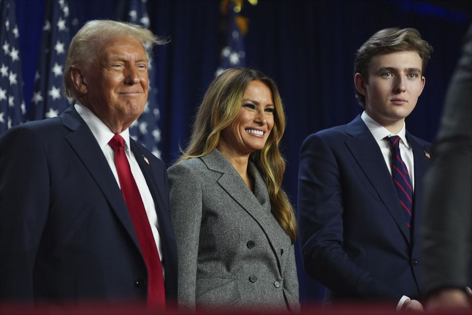 Donald Trump, former first lady Melania Trump and their son Barron Trump (Evan Vucci/AP)