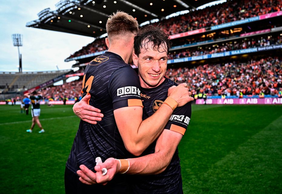 Armagh duo Barry McCambridge (right) and Rian O'Neill embrace following their victory over Kerry