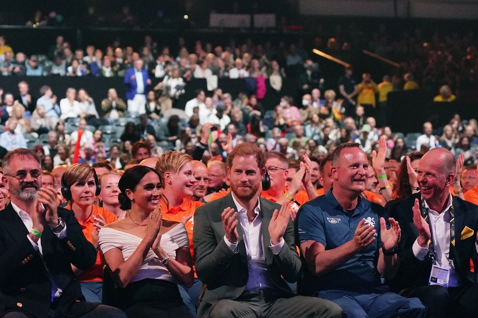 Dominic Reid with Harry and the Duchess of Sussex at the Invictus Games opening ceremony in the Hague in 2022 (Aaron Chown/PA)