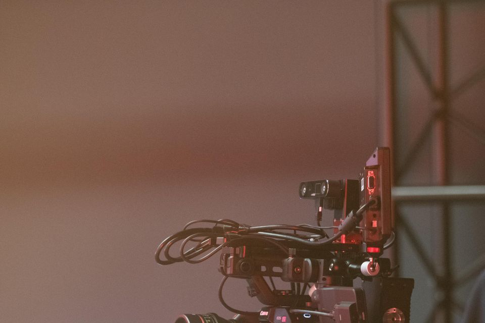 A videographer uses a cutting-edge camera atop a tripod in the new studio (Abertay University/PA)