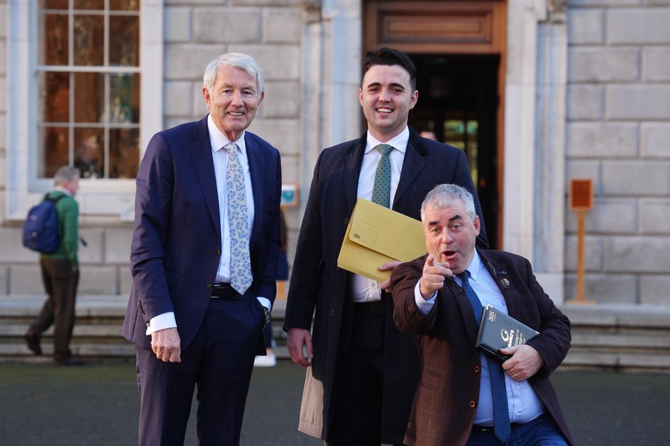 Members of Regional Independent Group (left to right) Michael Lowry, Barry Heneghan and Kevin ‘Boxer’ Moran at Leinster House in Dublin, after a deal was reached to form Ireland’s next government (Brian Lawless/PA)