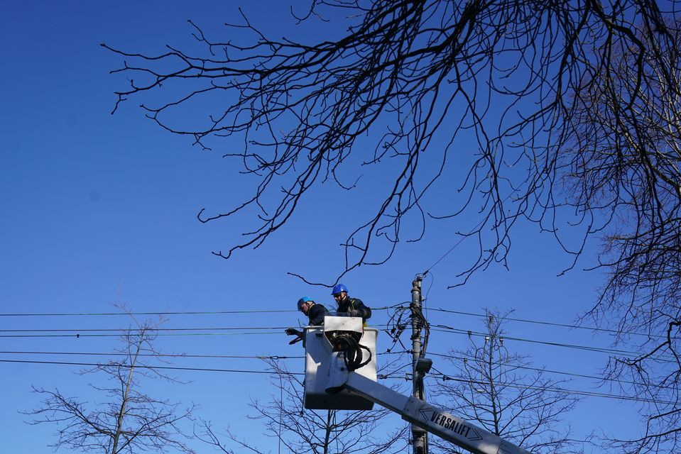 ESB Networks crew working to restore power in Avoca Avenue in Blackrock, Co Dublin, after Storm Eowyn (Brian Lawless/PA)