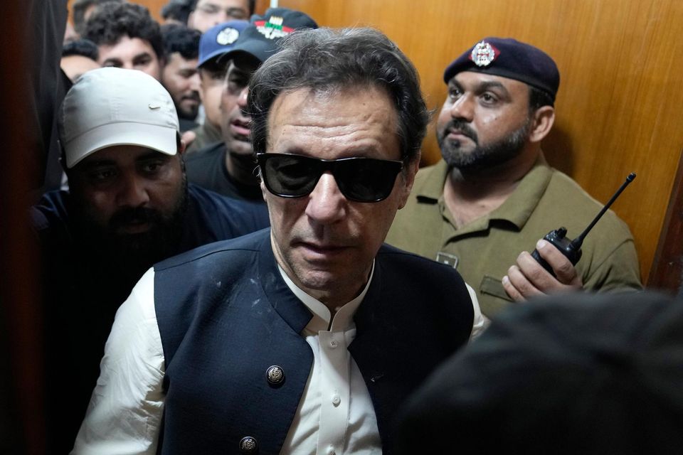 Former Pakistani prime minister Imran Khan leaves after appearing in a court, in Lahore, Pakistan on May 19, 2023 (KM Chaudary/AP/PA)