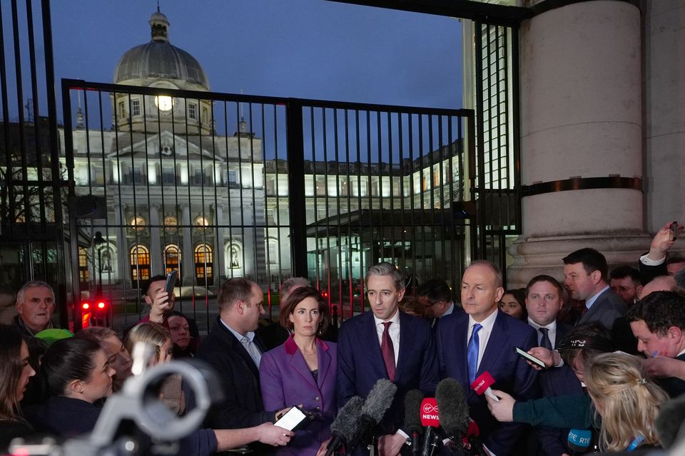 Government Chief Whip Hildegarde Naughton TD, Fine Gael leader Simon Harris TD, and Fianna Fail leader Micheal Martin address the media outside Government Buildings (Brian Lawless/PA)