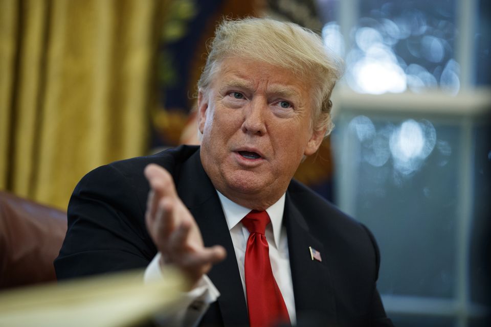 Donald Trump speaks during an interview with The Associated Press in the Oval Office in 2018 (Evan Vucci/AP)