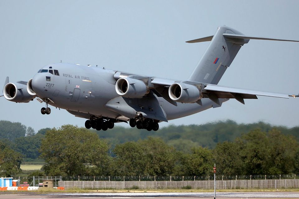 BRIZE NORTON, ENGLAND - JULY 01:  The RAF C17 aircraft lands at RAF Brize Norton carrying the victims of last Friday's terrorist attack in Tunisia, on July 1, 2015 in Brize Norton, England. British nationals Adrian Evans, Charles Evans, Joel Richards, Carly Lovett, Stephen Mellor, John Stollery, and Denis and Elaine Thwaites are the first of the victims of last week's terror attack to be repatriated.  (Photo by Joe Giddens-WPA Pool/Getty Images)