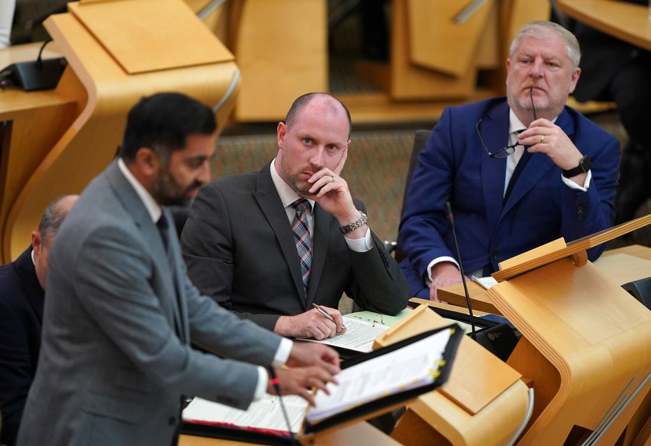 Angus Robertson, right, and Neil Gray, centre, have written to the Foreign Office while Humza Yousaf, left, is a ‘godparent’ to a political prisoner in Belarus (Andrew Milligan/PA)