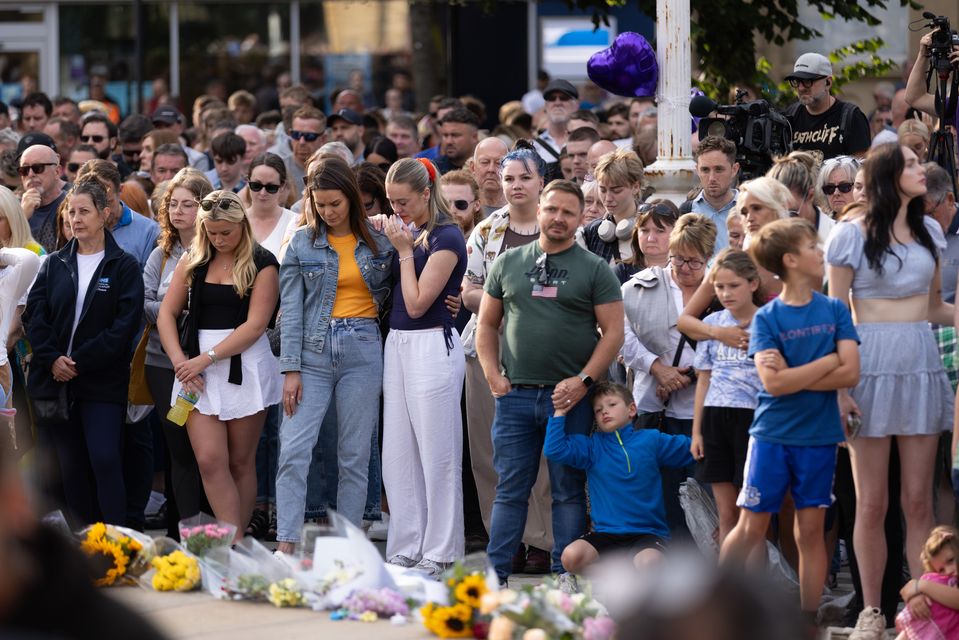 Members of the public take part in a vigil near the scene of the attack in Hart Street, Southport (James Speakman/PA)