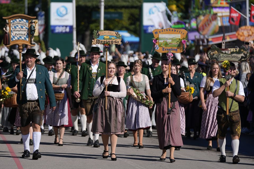 The traditional Oktoberfest music bands parade at the start of the festival (Matthias Schrader/AP)