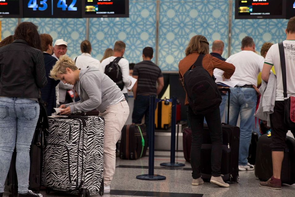 Tourists leave Tunisia at the Enfidha International airport after a shooting attack at the Imperial hotel in the resort town of Sousse, a popular tourist destination 140 kilometres (90 miles) south of the Tunisian capital, on June 27, 2015. At least 38 people, including foreigners, were killed in a mass shooting at a Tunisian beach resort packed with holidaymakers, in the North African country's worst attack in recent history. AFP PHOTO / KENZO TRIBOUILLARDKENZO TRIBOUILLARD/AFP/Getty Images