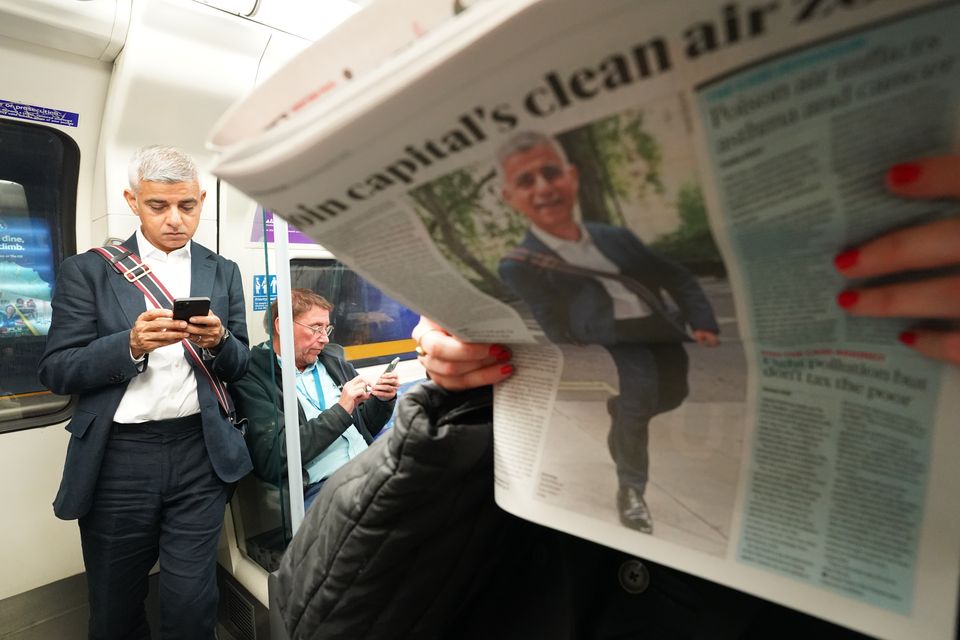 Sir Sadiq travelling on the London Underground (Stefan Rousseau/PA)