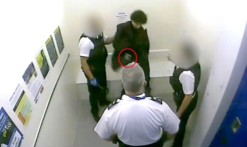 Screen grab taken from CCTV of Louis De Zoysa who is holding an item in his hand seconds before Sergeant Matt Ratana (centre) was fatally shot (Metropolitan Police/PA)