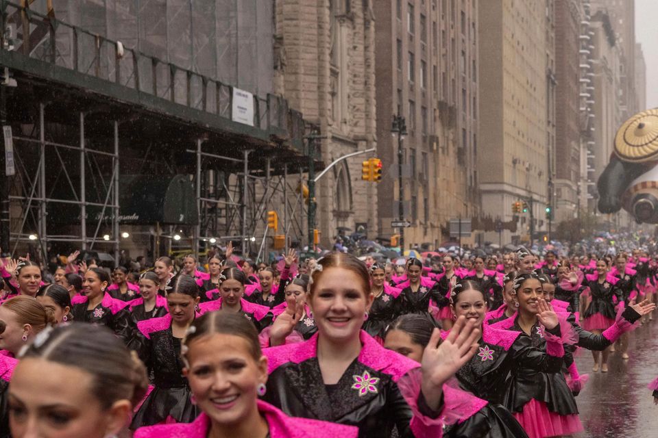 Parade performers march down Central Park West (Yuki Iwamura/AP)