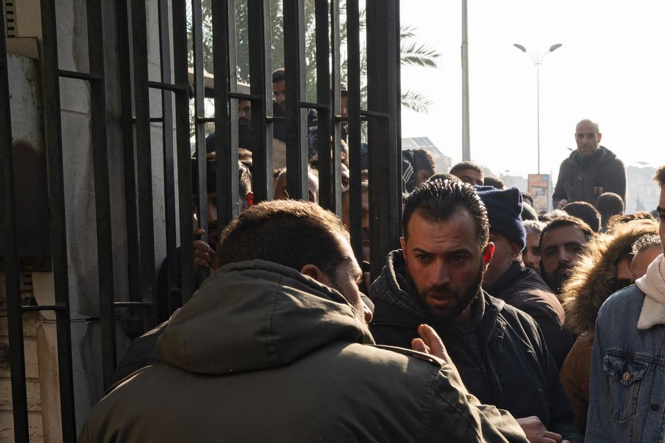 Members of Bashar Assad’s army are being questioned (Leo Correa/AP)