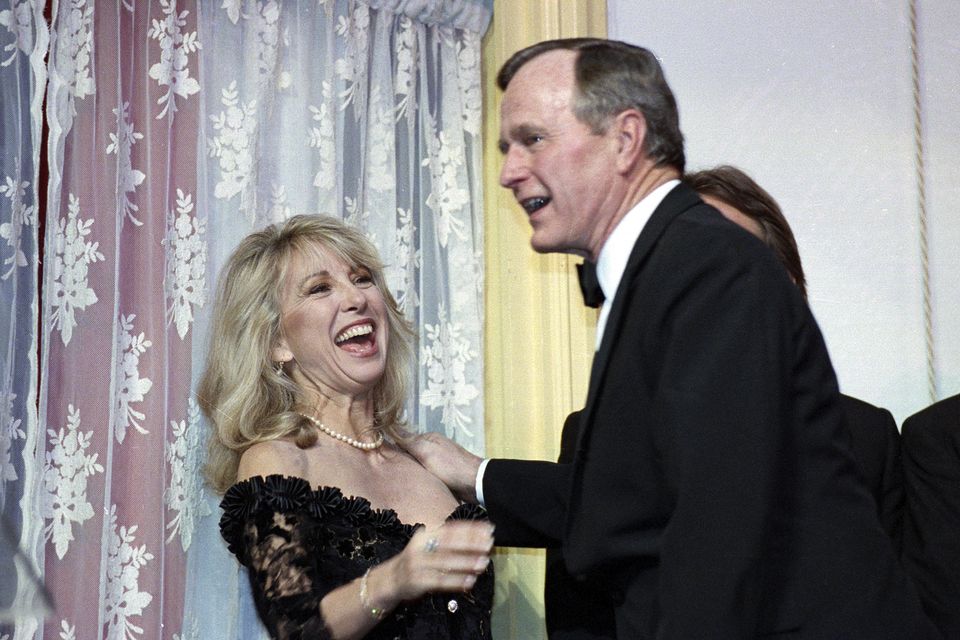 Teri Garr is all smiles after being kissed by President Bush during a fundraising gala for the historic Ford’s Theatre in Washington on March 20 1991 (Ron Edmonds/AP)