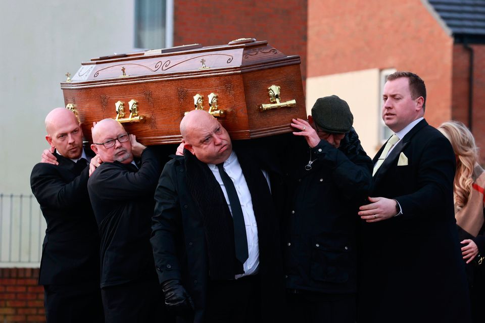 Billy (father, front left), Darren (brother, far left) and grandfather Joseph Hardy (front right) carry the coffin of murdered Belfast man John George. Photo: Liam McBurney