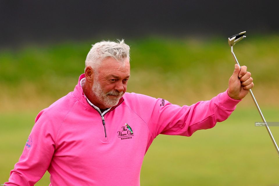 Darren Clarke acknowledges the crowd on the 18th green