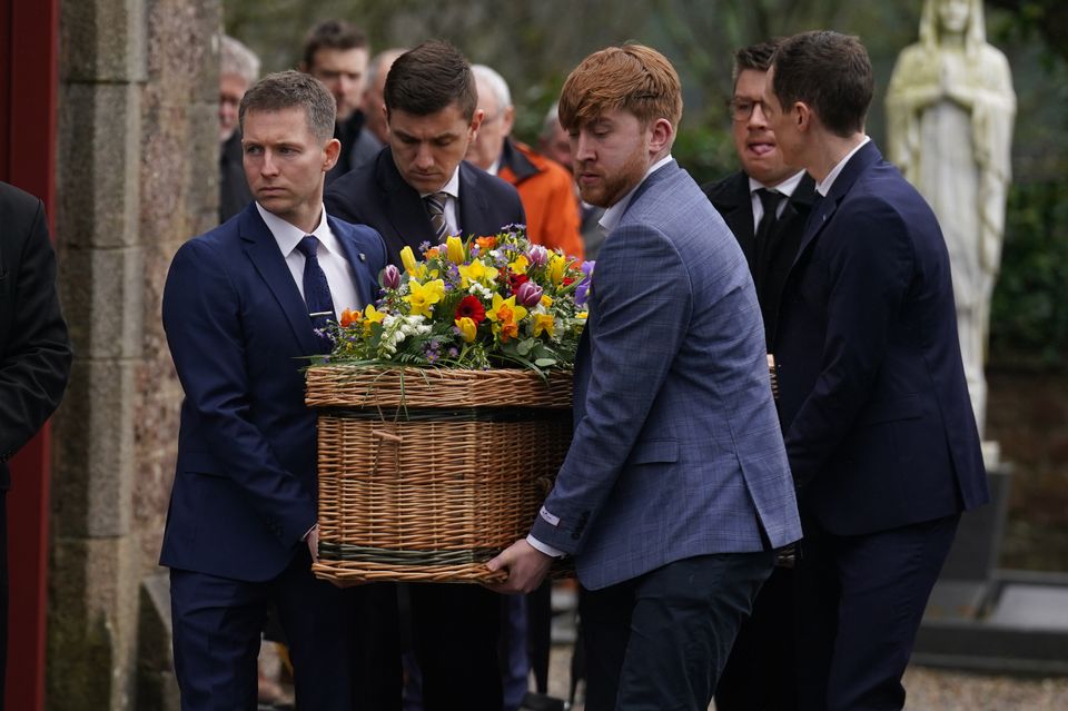 Nick Sheridan’s brother Brian (front left) helped carry the casket from the funeral of the TV presenter and journalist at St Ibar’s Church in Castlebridge, Co Wexford (Brian Lawless/PA)