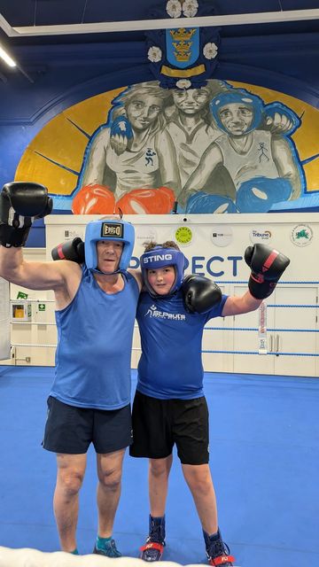 Richard Longthorpe in the boxing ring with his grandson, also named Richard (St Paul’s Boxing Academy/PA)