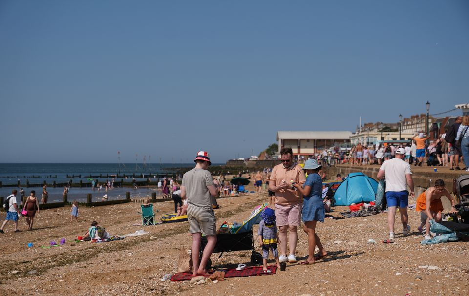 People enjoy the hot weather at Hunstanton beach in Norfolk (Joe Giddens/PA)