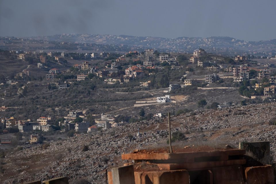 Backdropped by a Lebanese village an Israeli army position sits near the Israeli-Lebanese border, during the ceasefire between Israel and Hezbollah (Leo Correa/AP)