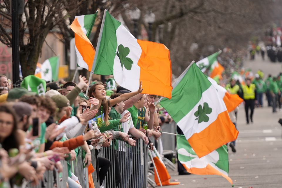 Spectators celebrate during the St Patrick’s Day parade on Sunday, March 16 in Boston (AP/Robert F Bukaty)