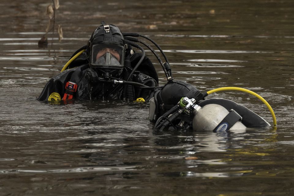 Divers have been searching a pond for three days near where police found a discarded backpack believed to belong to the gunman (Yuki Iwamura/AP)