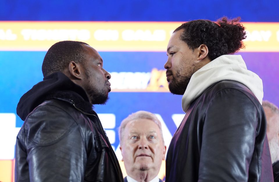 Dillian Whyte and Joe Joyce go face to face with Frank Warren in the background (Peter Byrne/PA)