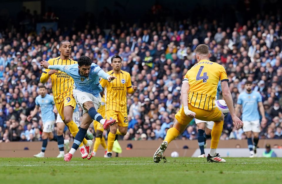 Omar Marmoush, left, scores Manchester City’s second goal but Brighton hit back (Martin Rickett/PA)